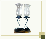 Two Glass Hurricanes on Wooden Stand