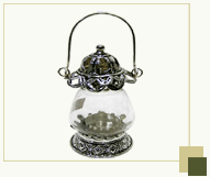 Glass Hurricane with silver antique top and bottom