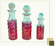 Set of 3 dotted red perfume bottles