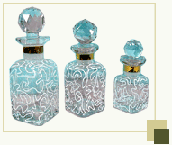 Set of 3 perfume bottles with spiral network