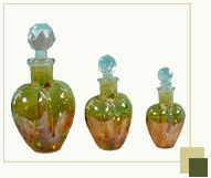 Set of 3 heart shaped yellow perfume bottles