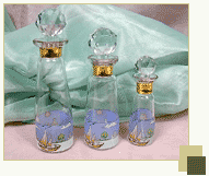 Set of 3 perfume bottles with sailboat