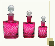 Set of 3 flat handcarved red perfume bottles
