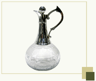 Wine decanter with silver plated handle and top
